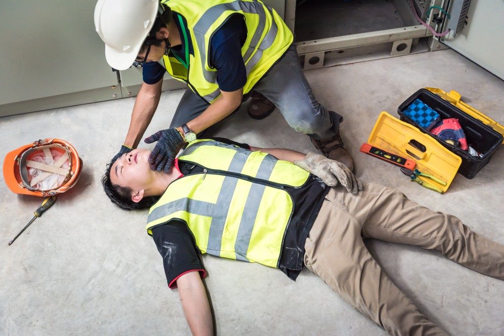 Injured worker lying on the floor