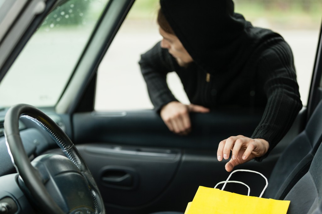 thief breaking into the car