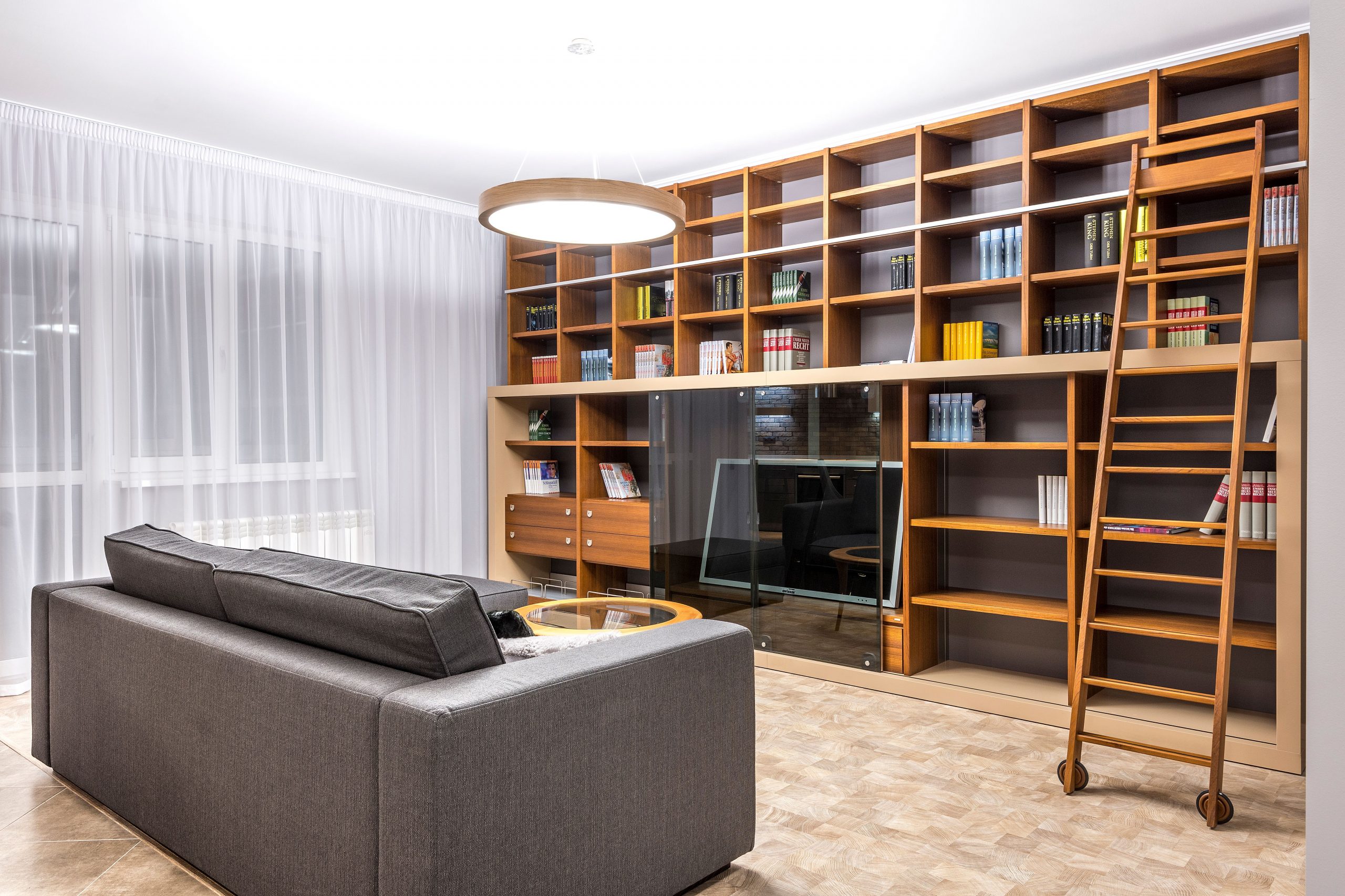 family room addition with floor-to-ceiling bookcases